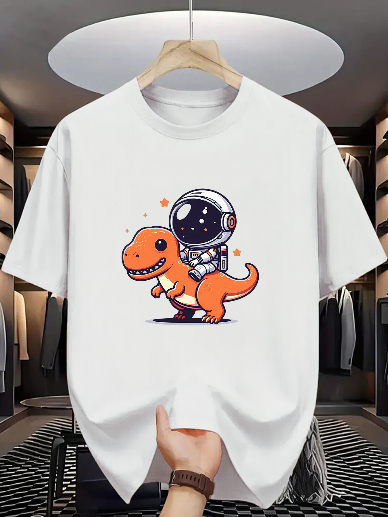 Men's Graphic T-Shirt Playful Orange Dinosaur Wearing Cute Astronaut Helmet Walking Under Stars Dinosaur
