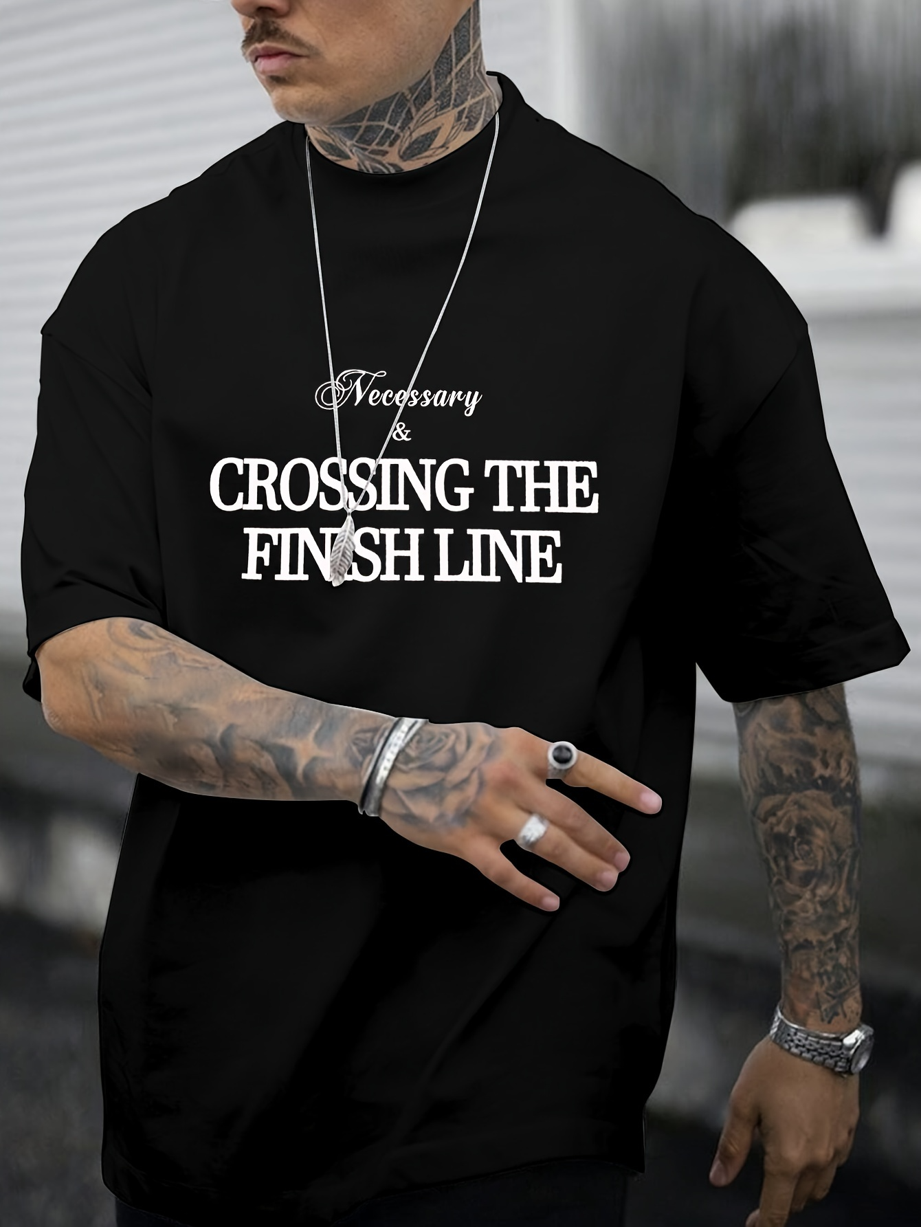 Men's Graphic T-Shirt Necessary Motivation With Bold Inspiring Letters Adorning Black T Shirt