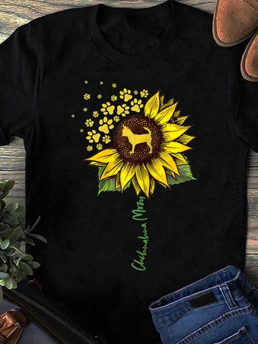 Women's Graphic T-Shirt Sunflower With Paw Prints Blooming Around Playful Dog
